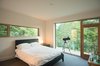 A bedroom with a tree top view Photo 7 of Connecticut Home modern home