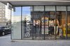 Full mounted dubbel glazed glass panels to maximalize the retail products inside Photo 3 of SUPER DRY modern home