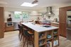 Modern home with Kitchen, Engineered Quartz Counter, Wood Cabinet, Light Hardwood Floor, Ceramic Tile Backsplashe, Pendant Lighting, Refrigerator, Range Hood, Range, Recessed Lighting, Microwave, Dishwasher, and Undermount Sink. Kitchen Photo 5 of Selby Residence