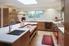 Modern home with Kitchen, Engineered Quartz Counter, Wood Cabinet, Light Hardwood Floor, Ceramic Tile Backsplashe, Recessed Lighting, Pendant Lighting, Undermount Sink, Wine Cooler, Range Hood, and Range. Kitchen Photo 4 of Selby Residence