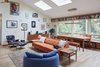 Modern home with Dining Room, Bench, Table, Chair, Lamps, Pendant Lighting, and Light Hardwood Floor. Living + Dining Photo 9 of Selby Residence