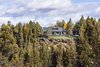 Modern home with Exterior, Gable RoofLine, Flat RoofLine, House, Shingles Roof Material, and Wood Siding Material. The house sits at the edge of the bluff taking advantage of the incredible views of the canyon and river below. Photo 10 of Ranger’s Ridge
