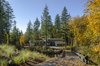 Modern home with Exterior, Stucco Siding Material, Wood Siding Material, Flat RoofLine, and House Building Type. Access to the site is provided by shared private road down to a small clearing between the protected trees and habitat. Photo of Wildwood