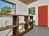 Modern home with Hallway and Concrete Floor. The open shelves are by Matt Eastvold, and feature a ultra clear glass back. Photo 8 of Trestle Glen Modern