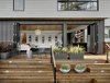 Modern home with Outdoor. The back of the house features a combination of Hardi-Panel lap siding and board and batten, which are in a series of greys softened by the redwood deck and plantings. Photo 7 of Trestle Glen Modern