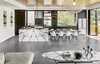 Modern home with Kitchen, Range Hood, Marble Counter, and Pendant Lighting. The floors have hydronic heating embedded in a matte finished concrete. The stone slab is Calacatta Viola. The table is custom designed by the architect and fabricated by Gerardo Villa. Photo 3 of Trestle Glen Modern