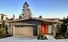 Pervious large concrete pavers are used for the garage drive and entry. The entry porch is setback and features a large skylight that allows light to pass through to the floors below
Photo 2 of Trestle Glen Modern modern home