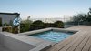 The custom built spa was a must have for the homeowners, and features a concealed solar cover beneath the deck boards. It was raised to offer the dramatic view of downtown San Francisco and the East Bay Hills beyond. The interior of the spa is integral color plaster with a Quartzite slab liner at the water line. The sunken conversation pit lies next to the spa and features radiant tubes imbedded in its cantilevered concrete seat. Photo 15 of Twin Peaks Escape Pad modern home