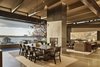 Modern home with Living Room, End Tables, Sofa, Ceiling Lighting, Concrete Floor, Two-Sided Fireplace, Chair, and Console Tables. Great Room with steel-clad fireplace, concrete floors and wood beams Photo 2 of Union Bay Residence