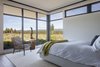 Modern home with Chair and Light Hardwood Floor. Master bedroom Photo 11 of High Desert Modern
