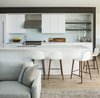 Modern home with Kitchen, Light Hardwood Floor, Quartzite Counter, Range Hood, Glass Tile Backsplashe, Undermount Sink, and White Cabinet. Kitchen Photo 7 of High Desert Modern
