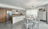 Modern home with Dining Room, Concrete Floor, Stools, Table, Pendant Lighting, and Accent Lighting. Kitchen/Dining/Work Area Photo 3 of Live/Work Space