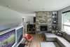 The reason the 'kitchen flip' worked in the architects mind is evidenced in this photo. The sunken living room has a visual connection with the kitchen. Photo 19 of Burlington Residence modern home