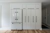 "Ganging" all of the 'vertical' elements (refrigerator, pull-out pantries, etc) into a recessed niche minimizes spacial intrusions. Photo 17 of Burlington Residence modern home