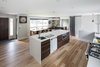 The architect credited the 'kitchen flip' as the reason the bungalow remained a bungalow. All of the 2nd floor addition work ended when the kitchen moved to 'opposite the entry'. Prior to that, the kitchen was 'beside the entry' (where the Dining area is). Photo 13 of Burlington Residence modern home