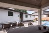 The material palette on the pool side elevation is lighter than the road side. Photo 12 of Burlington Residence modern home