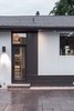 The Pool Side Elevation has windows which also reveal interior spacial conditions. Photo 11 of Burlington Residence modern home