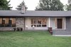 Landscape grading was employed to ensure there was no need for guards. Photo 8 of Burlington Residence modern home
