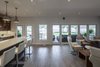 Kitchen, Dining, Living all orient themselves to see the water. Photo 11 of Turkey Point Beach House modern home