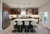 The kitchen island is a hub in the design. Photo 16 of Turkey Point Beach House modern home