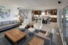 The sequence of living, dining, kitchen is oriented adjacent to a continuous exterior deck. Photo 18 of Turkey Point Beach House modern home