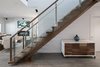 The stair is also solid American walnut, built from a single log. Photo 19 of Turkey Point Beach House modern home
