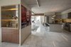 Two Credenzas were inserted either side of a niche within the space. A bar faces the Living Room and a dining hutch faces the Dining Room. Photo 6 of Thompson Hotel Private Suite modern home