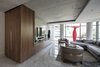 The mass of the TV Unit is heightened at the end, where it folds up into a vertical closet Photo 14 of Thompson Hotel Private Suite modern home