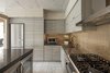 Modern home with Kitchen, Metal Backsplashe, Refrigerator, Beverage Center, Range, Undermount Sink, and Microwave. A new metallic, profiled backslash was added. Photo 3 of Thompson Hotel Private Suite