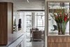 Custom millwork was inserted into the space to not only house it's function, but also give definition to the spaces. The openness or intimacy of spaces are defined by the millwork. Photo 5 of Thompson Hotel Private Suite modern home