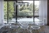 There was a great will to keep things transparent and open - which lead to a glass dining table and clear dining chairs. Photo 12 of Thompson Hotel Private Suite modern home