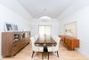 Modern home with Dining Room, Storage, Chair, Lamps, Table, Ceiling Lighting, Pendant Lighting, Accent Lighting, and Light Hardwood Floor. A large nelson bubble lamp and mid-century furniture at the formal dining room complement the painted blue coffered ceiling. Photo 8 of Villa Park Modern