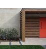 Modern home with Exterior, Swing Door Type, Outdoor, Front Yard, Walkways, Hardscapes, Grass, Shrubs, Small Patio, Porch, Deck, Wood Patio, Porch, Deck, Concrete Patio, Porch, Deck, Horizontal Fences, Wall, and Wood Fences, Wall. Concrete, grass, gravel and cedar at courtyard entry. Photo 2 of Laguna Niguel Mid-Century