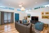 Modern home with Living Room, Sofa, Chair, Pendant Lighting, Ceiling Lighting, and Medium Hardwood Floor. clerestory windows at mid-century living room Photo 9 of Niguel West Mid-century Modern
