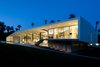 Modern home with Exterior, Mid-Century Building Type, House Building Type, Flat RoofLine, and Stucco Siding Material. Desert Canopy House -- a wall of glass faces the mountains and the large overhang protects it from the sun and heat. Photo of Desert Canopy House