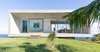 Modern home with Exterior, House Building Type, Tile Roof Material, Flat RoofLine, and Stone Siding Material. QK House Photo of QK House