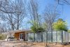 Modern home with Exterior, House Building Type, Wood Siding Material, and Stucco Siding Material. Entry & Carport Photo of Custer