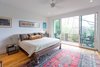 Master bedroom with balcony Photo 7 of Tall Haus modern home
