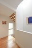 Modern home with Hallway and Light Hardwood Floor. Holler Hole Photo 18 of Tall Haus