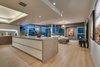 The Twelve Foot Long Assymetrical Island Anchors the Open Floor Plan Photo 2 of The Vogel Residence modern home