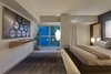The Master Bedroom's Platform Bed is Accented with LED Lighting to Add Levity to its Mass Photo 4 of The Vogel Residence modern home