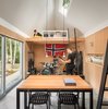 Modern home with Kids Room, Playroom Room Type, Family Room Room Type, Storage, Bookcase, Chair, Teen Age, Concrete Floor, Pre-Teen Age, and Neutral Gender. Rehearsal Space Photo 5 of The Long Studio