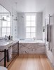 Modern home with Bath Room, Marble Counter, Light Hardwood Floor, and Undermount Tub. Clinton Hill Townhouse Renovation - Master Bath Photo 4 of Clinton Hill Townhouse