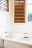 Bath fixtures are original and honest, honoring authentic period details. Photo 6 of SOMO: southern mod modern home