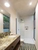 Modern home with Bath Room, Marble Counter, Open Shower, Cement Tile Floor, Undermount Sink, Pendant Lighting, Concrete Wall, and One Piece Toilet. White polished concrete walls contrast with the colorfull Cement Tiles and the Marble on counter Photo 2 of Lemon Tree House