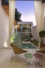 Modern home with Outdoor, Trees, Plunge Pools, Tubs, Shower, Concrete Patio, Porch, Deck, and Horizontal Fences, Wall. The patio is the prefect conector of the old and new architecture Photo 13 of Lemon Tree House