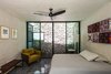 Modern home with Bedroom, Chair, Cement Tile Floor, Lamps, and Bed. A Light well provide natural light and ventilation to the downstairs bedroom Photo 3 of Lemon Tree House