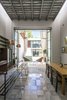 Modern home with Dining Room, Pendant Lighting, Table, Chair, and Bench. The transistion from Outside-Inside- is gradual, same concept to the transition from the old struture to the contemporary architecture. Photo 10 of Lemon Tree House