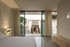 Modern home with Bedroom, Bench, Table Lighting, Bed, Cement Tile Floor, and Bookcase. A great view from the upstairs bedroom Photo 17 of Lemon Tree House