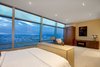 Modern home with Bedroom, Bed, Dresser, Night Stands, Bench, Shelves, Storage, Bookcase, Rockers, Ceiling Lighting, Recessed Lighting, Accent Lighting, and Carpet Floor. Master Bedroom Photo 18 of Ritz-Carlton Residences, 48G